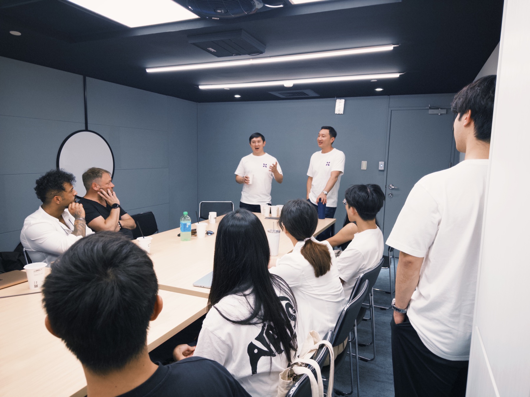 886 Studios founders gathered around a table during a program session