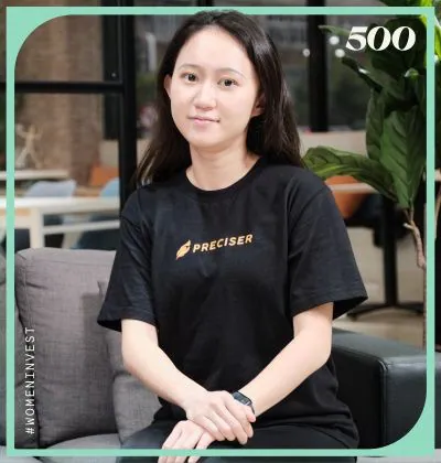 Shirley Chen seated in a Preciser shirt