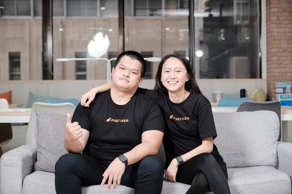 The Preciser founding team seated together in their office